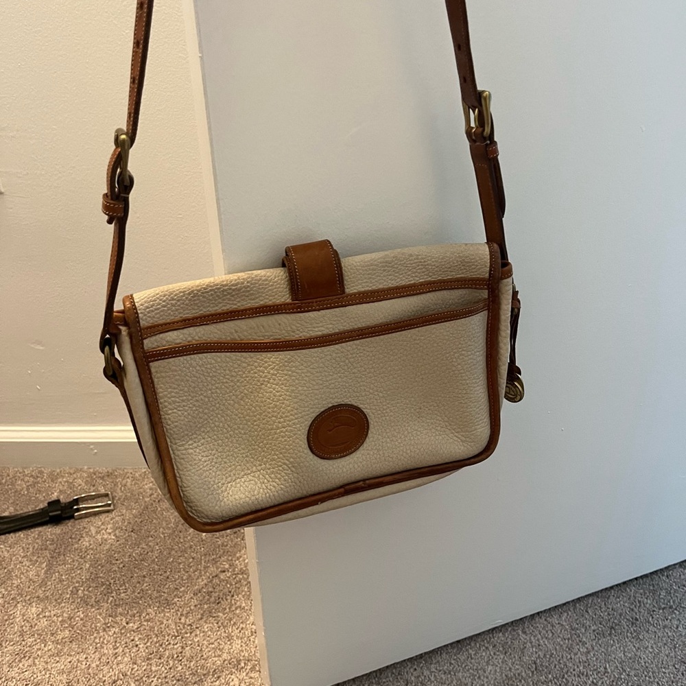 Dooney and Bourke classic ivory leather handbag.